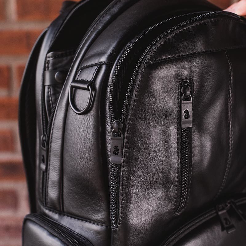 Nordweg black leather backpack handle and zipper close-up