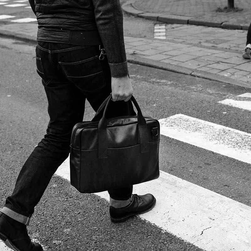 Nordweg black leather briefcase crosswalk lifestyle photo