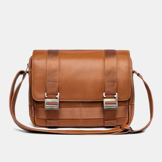 Nordweg Dolomites leather satchel shoulder bag in caramel, front view with buckles and strap