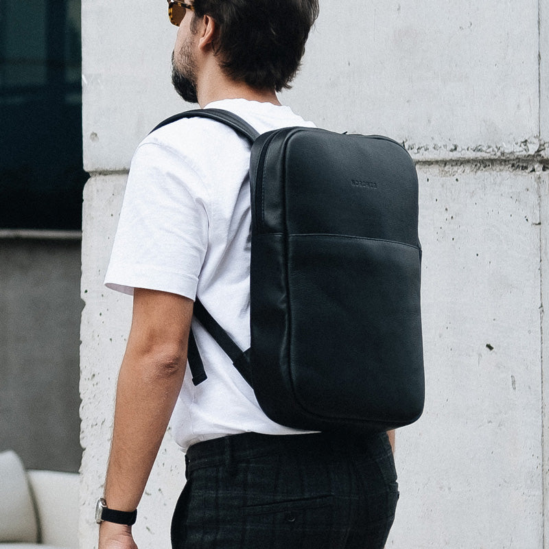 Nordweg NW108 Slim Workplace leather laptop backpack in Black, rear carry lifestyle view, SKU NW108.IP, GTIN 7898571002089