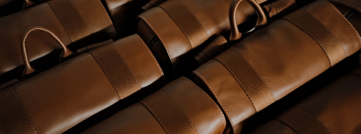 Close-up of brown leather and stitching detail for the Nordweg leather care page