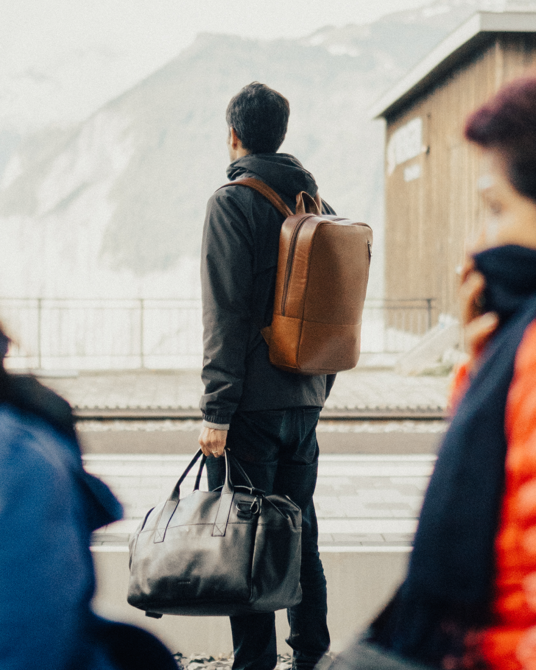 Nomad leather backpack and weekender carried in the mountains