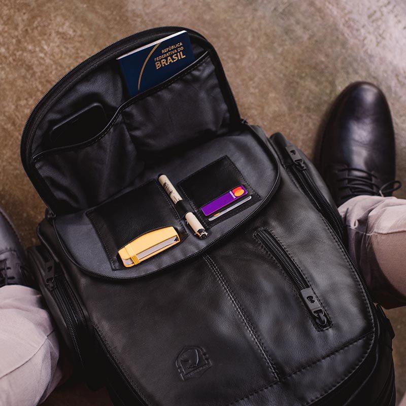 Nordweg black leather backpack open interior with everyday carry items