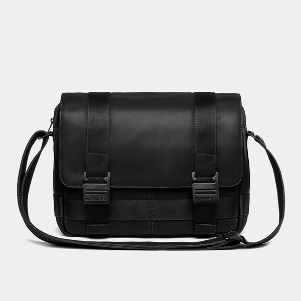 Nordweg Dolomites leather satchel shoulder bag in black, front view with buckles and strap