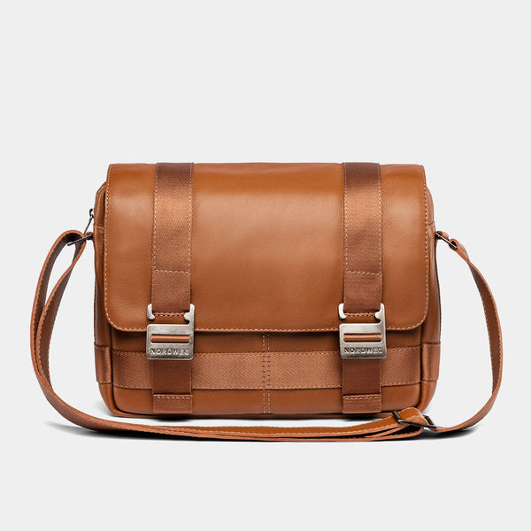 Nordweg Dolomites leather satchel shoulder bag in caramel, front view with buckles and strap