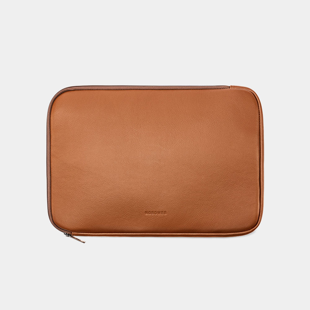 Caramel Dolomites leather satchel shown with matching laptop sleeve