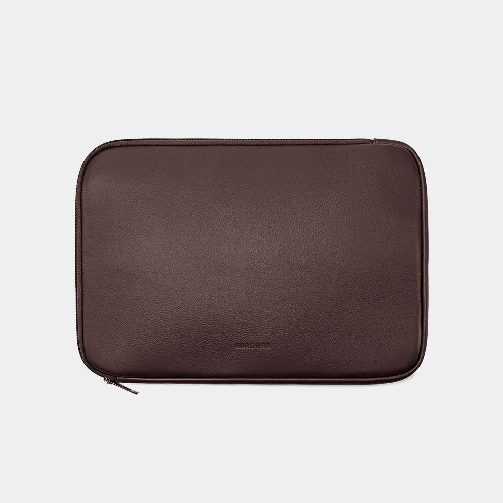 Coffee Dolomites leather satchel shown with matching laptop sleeve
