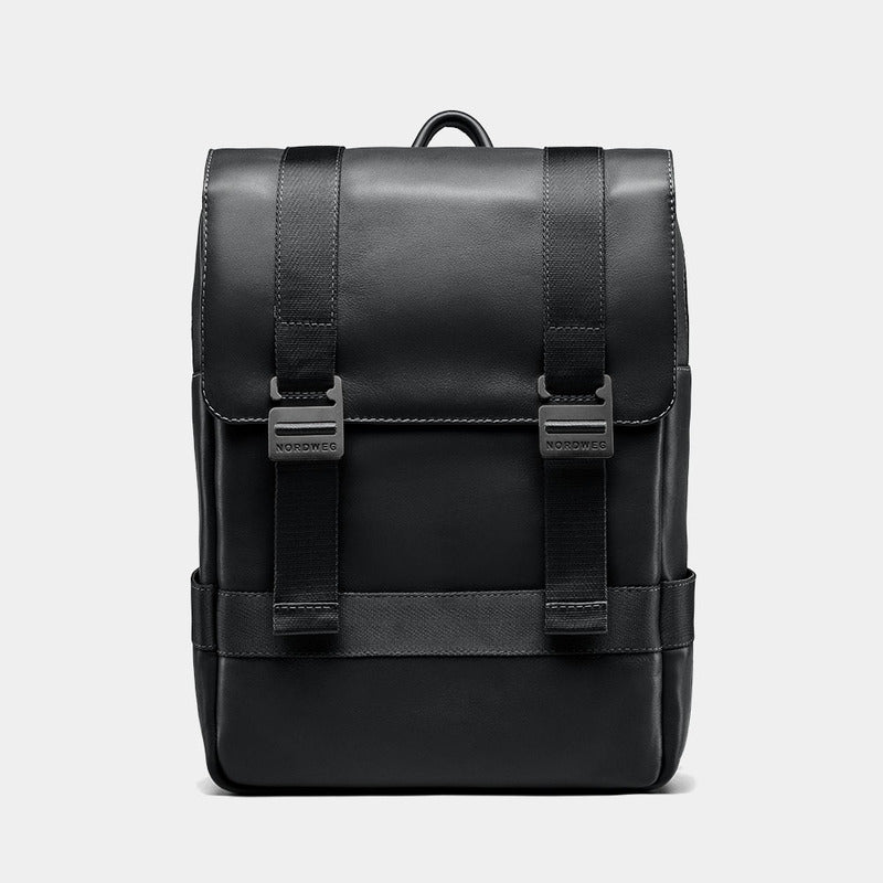 Nordweg Dolomites leather travel backpack in black, front view with flap and metal buckles