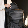 Nordweg Dolomites leather travel backpack in Black with front laptop access pocket open, SKU NW101.IP, GTIN 7898571001020