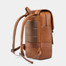 Nordweg Dolomites leather travel backpack in caramel, side view with padded back and shoulder straps