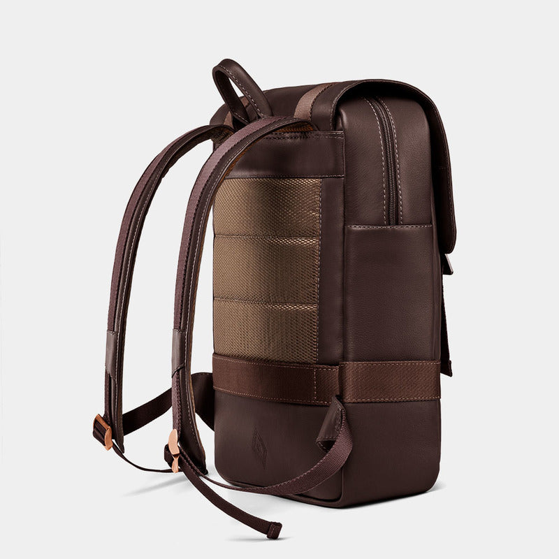 Nordweg Dolomites leather travel backpack in coffee, side view with padded back and shoulder straps