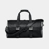 Nordweg Dolomites leather weekender travel bag in black, front view with shoulder strap