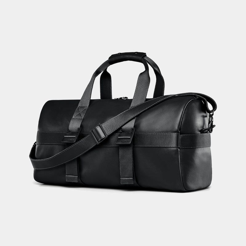 Nordweg Dolomites leather weekender travel bag in black, side view with handles