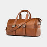 Nordweg Dolomites leather weekender travel bag in caramel, side view with handles