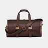 Nordweg Dolomites leather weekender travel bag in coffee, front view with shoulder strap
