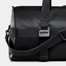 Close-up of the front buckle and shoulder strap on the Nordweg Dolomites Weekender in Black.