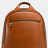 Close-up of the top handle, front zipper, and Nordweg crest on the Eagle Laptop Backpack in Caramel.