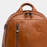 Close-up of the top handle, front zippers, and Nordweg crest on the Gramado Laptop Backpack in Caramel.