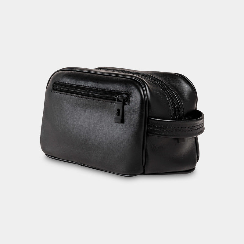 Nordweg Gramado leather dopp kit travel toiletry bag in black, side view with front zip pocket