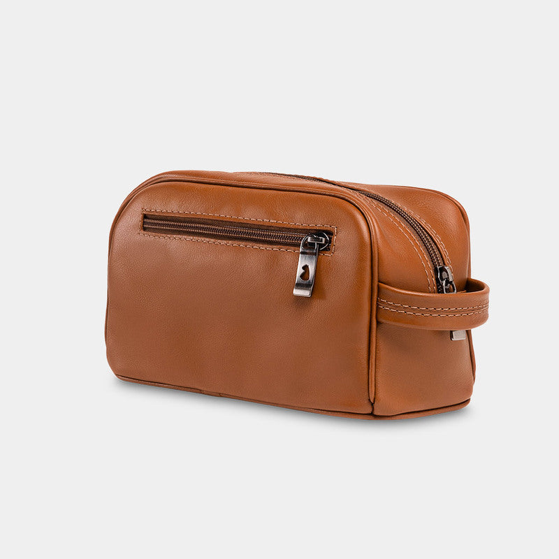 Nordweg Gramado leather dopp kit travel toiletry bag in caramel, side view with front zip pocket
