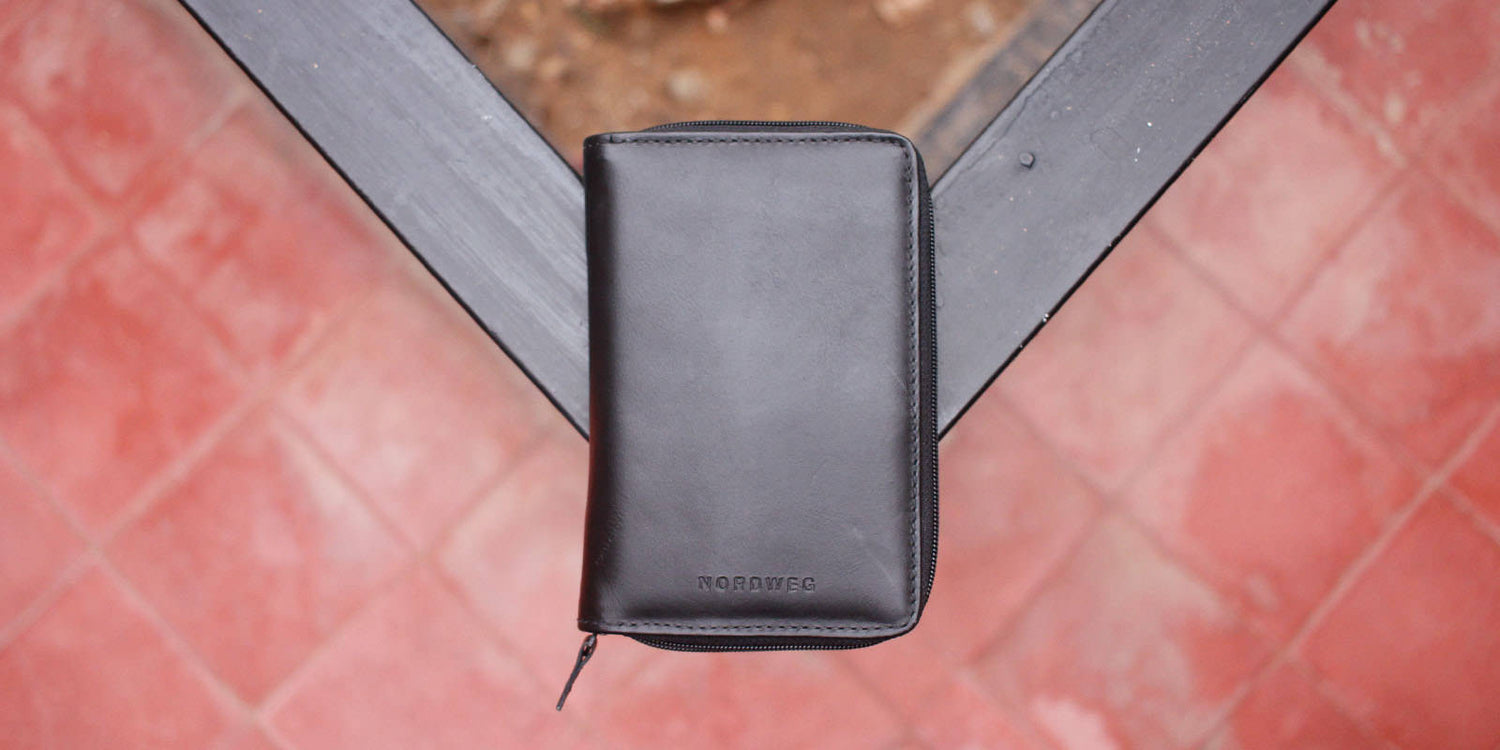 Nordweg leather wallet pocket close-up on a red surface