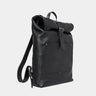 Nordweg Legacy leather backpack in coal, angled front view with roll-top and shoulder strap