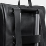 Coal Legacy leather backpack luggage pass-through on a rolling suitcase handle