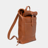 Nordweg Legacy leather backpack in cognac, angled front view with roll-top and shoulder strap