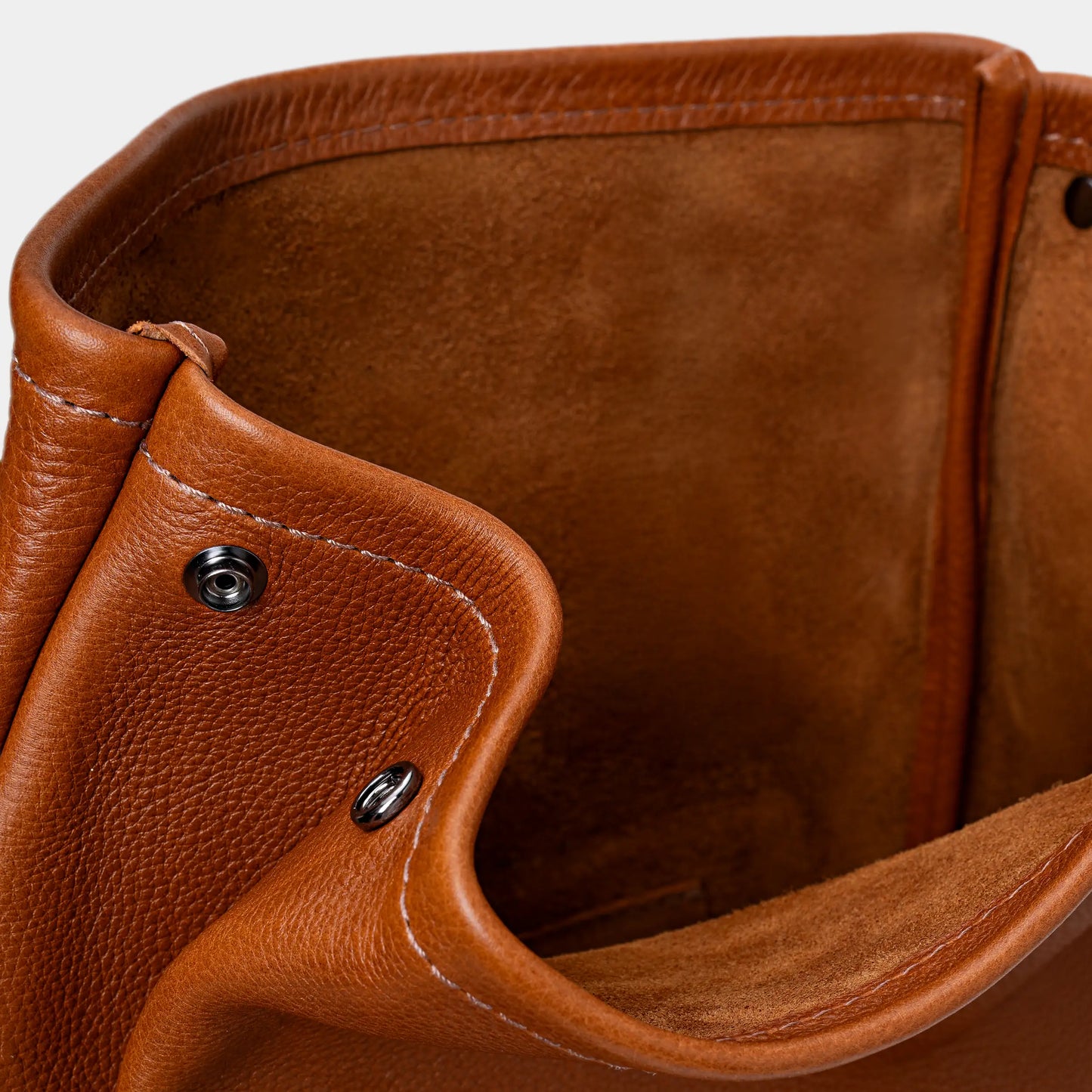 Close-up of cognac Legacy leather backpack interior with suede lining