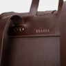 Close-up of the Legacy mark detail on the espresso Nordweg leather backpack