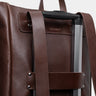Espresso Legacy leather backpack luggage pass-through on a rolling suitcase handle