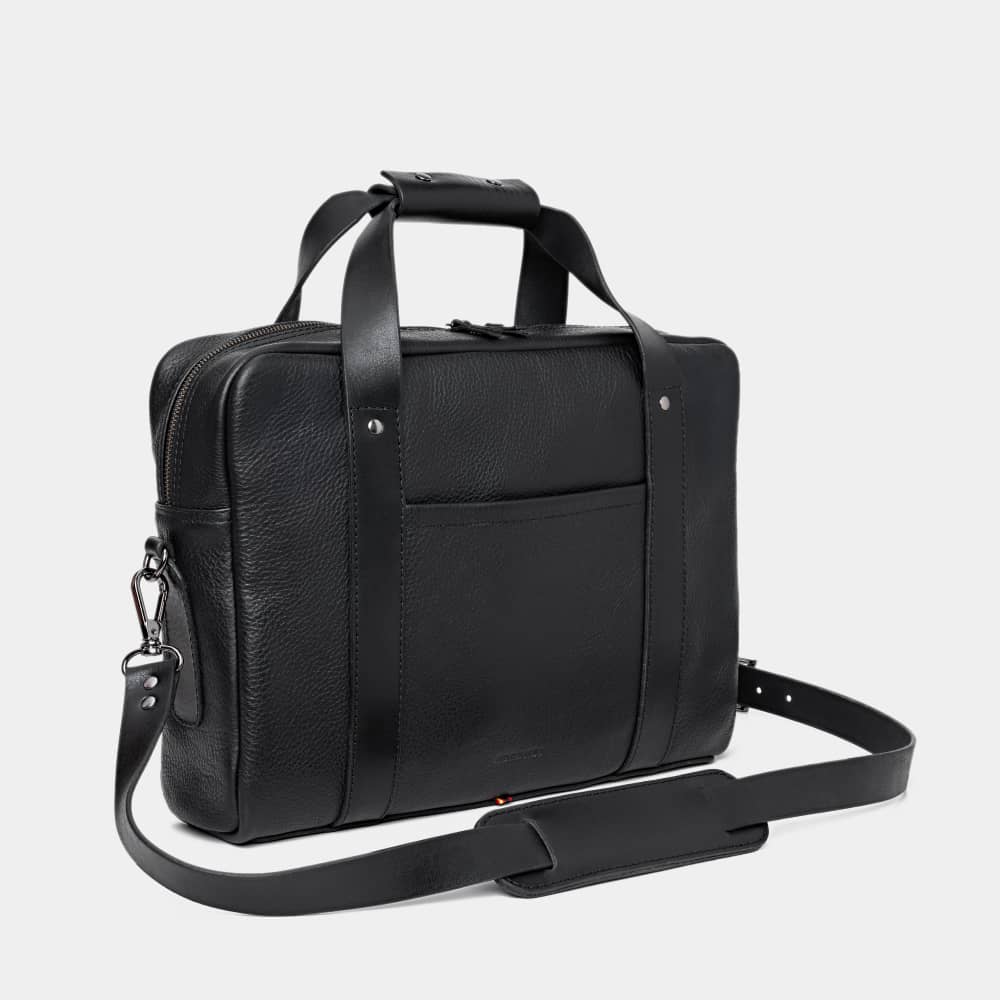 Nordweg Legacy leather briefcase laptop work bag in coal, angled front view with shoulder strap