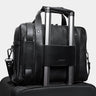 Coal Legacy leather briefcase luggage pass-through on a rolling suitcase handle