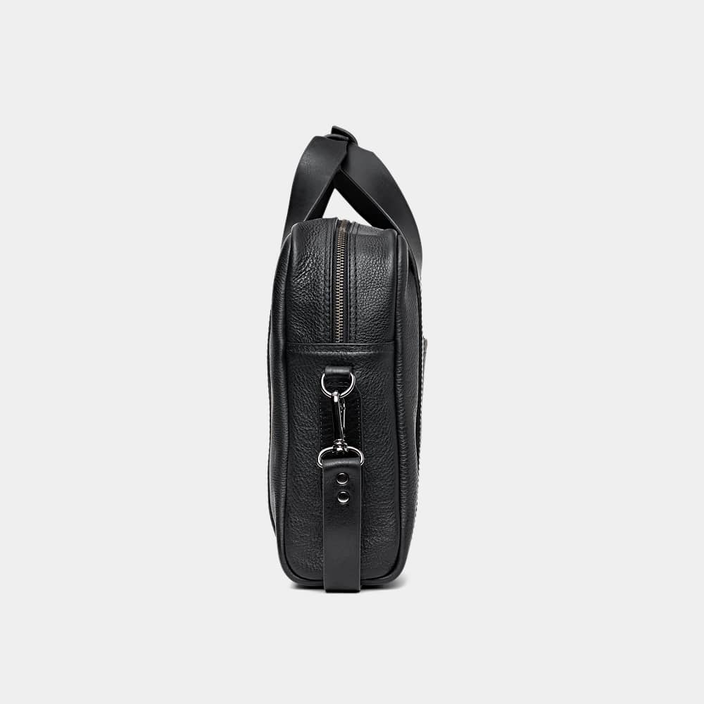 Nordweg Legacy leather briefcase laptop work bag in coal, side end view with strap hardware