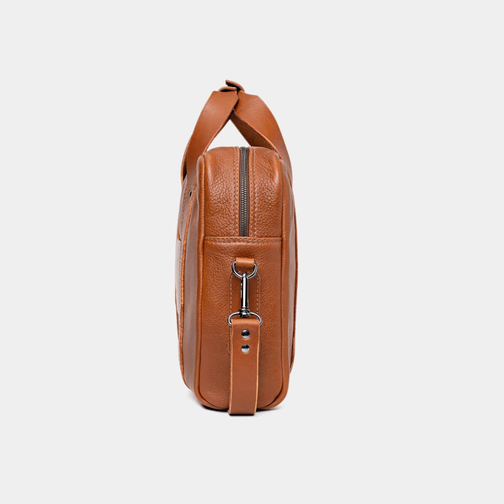 Nordweg Legacy leather briefcase laptop work bag in cognac, side end view with strap hardware