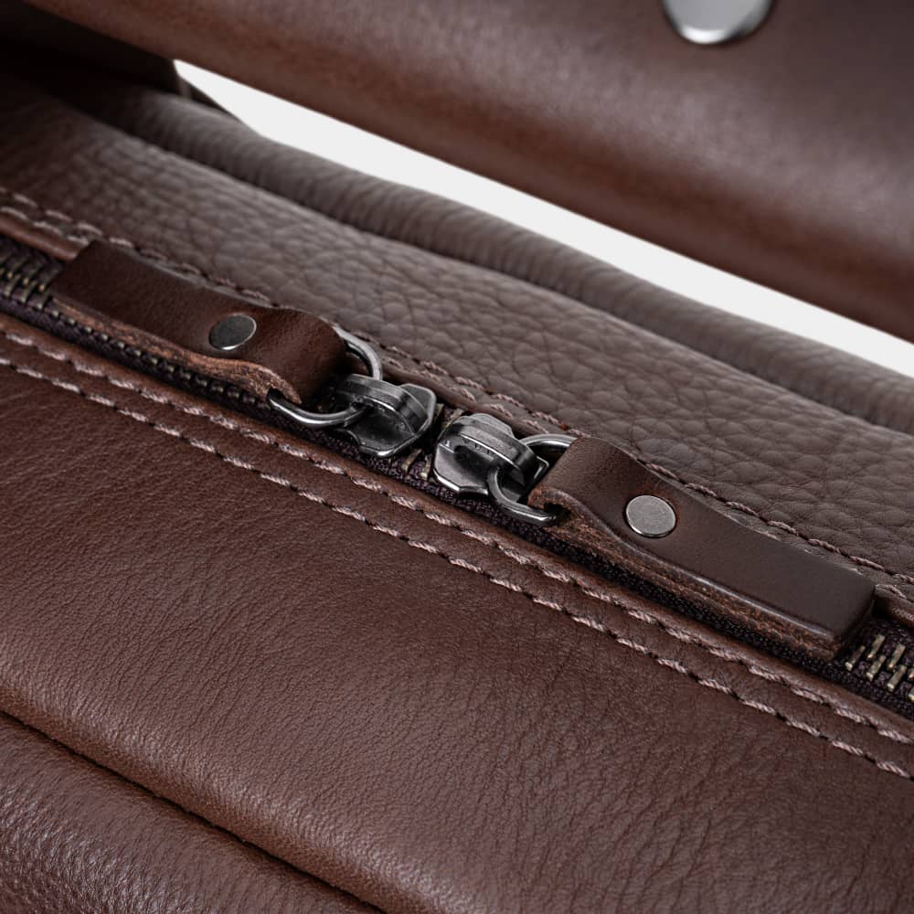 Close-up of espresso Legacy leather briefcase top zipper pulls