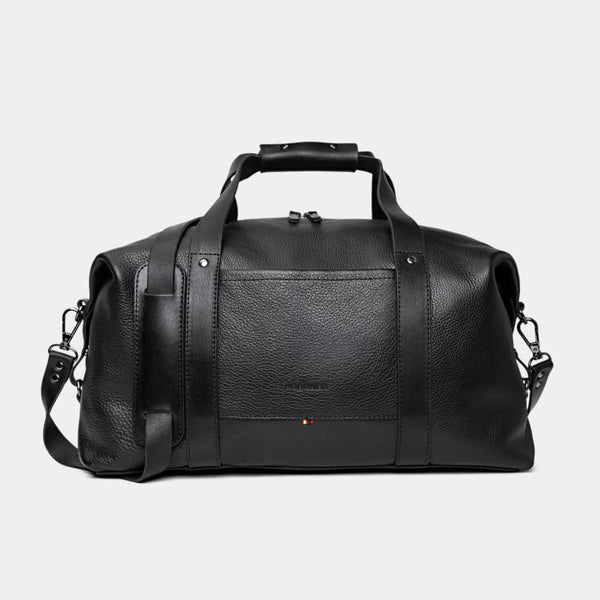 Nordweg Legacy leather duffel travel bag in coal, front view with handles and shoulder strap