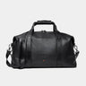 Nordweg Legacy leather duffel travel bag in coal, front view with handles and shoulder strap