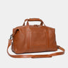 Nordweg Legacy leather duffel travel bag in cognac, angled front view with shoulder strap