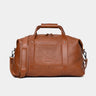 Nordweg Legacy leather duffel travel bag in cognac, front view with handles and shoulder strap