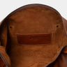 Open cognac Legacy leather duffel bag showing interior pocket