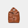 Nordweg Legacy leather duffel travel bag in cognac, side end view with handle and strap