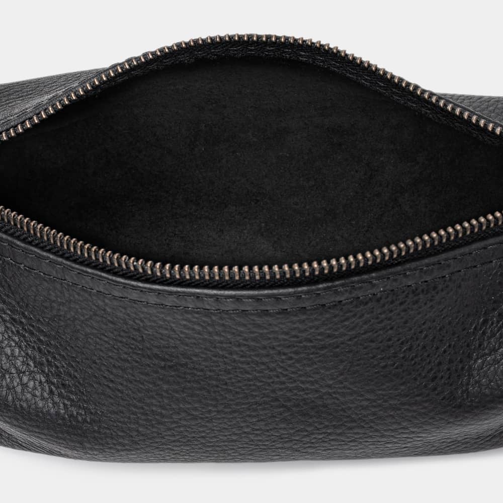 Open coal Legacy leather organizer pouch showing dark suede interior and zipper