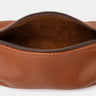 Open cognac Legacy leather organizer pouch showing suede interior and zipper