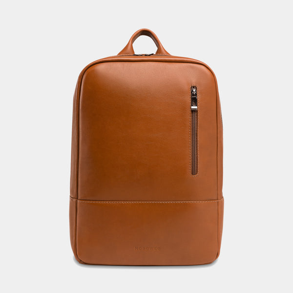 Nordweg Nomad leather laptop backpack in caramel, front view with vertical zip pocket