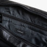 Open black Nordweg Nomad leather briefcase showing the lined interior pockets, SKU NW080A.IP, GTIN 7898571000696