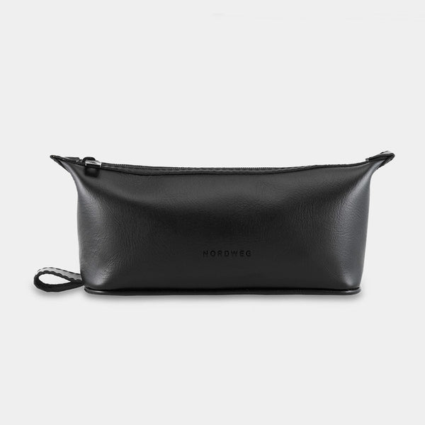 Nordweg Nomad leather dopp kit travel toiletry bag in black, front view with side loop