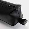 Close-up of black Nomad leather dopp kit hanging loop and zipper hardware