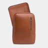 Caramel Nordweg Nomad leather laptop backpack shown with matching removable laptop sleeve