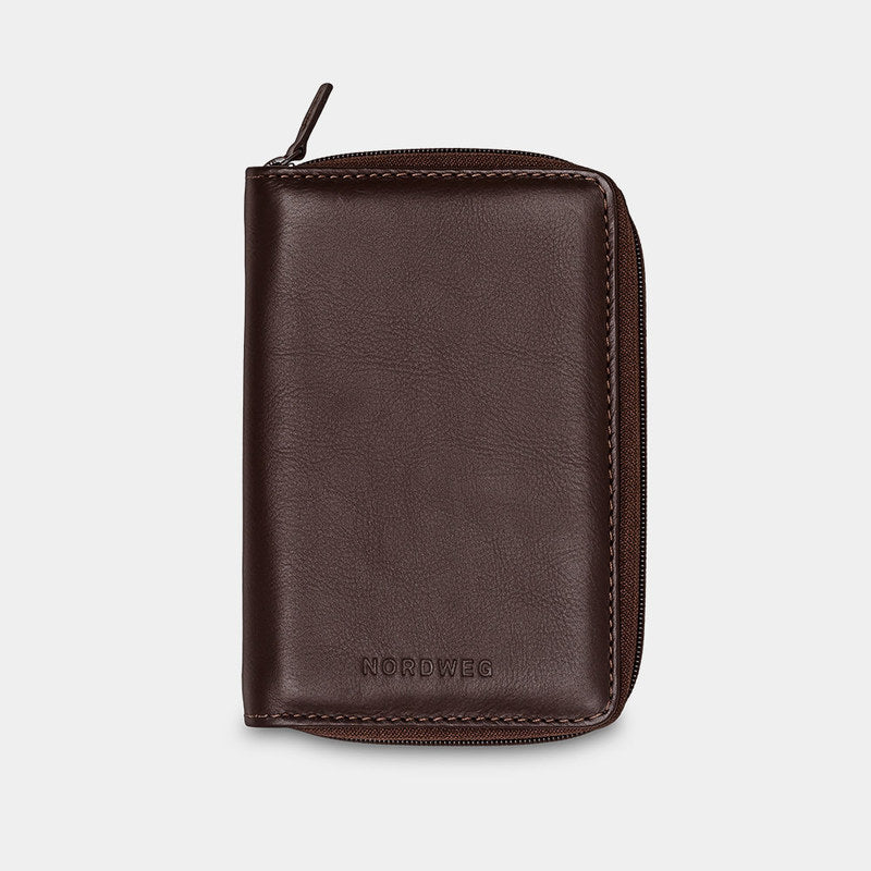 Nordweg Nomad leather passport wallet in coffee, front view with zip-around closure